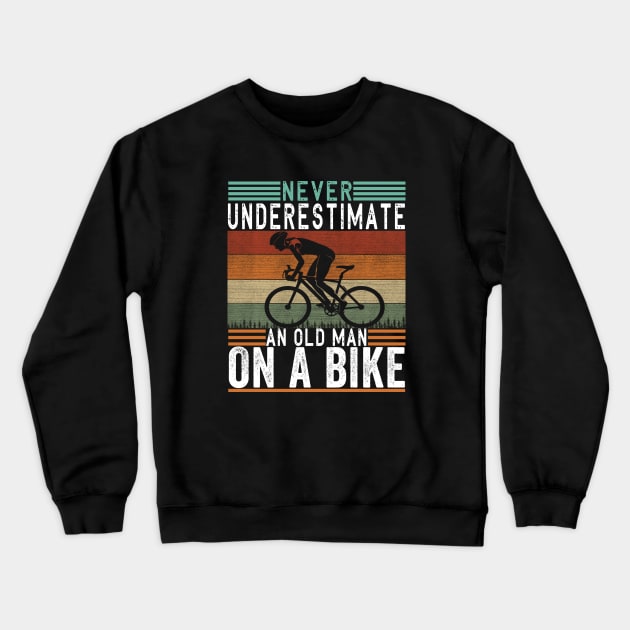 Never Underestimate An Old Guy On A Bicycle Funny Cycling Crewneck Sweatshirt by The Design Catalyst